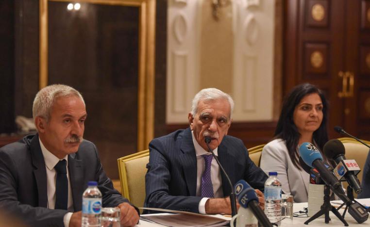 The removed mayor of Mardin Ahmet Turk (C) speaks during a foreign media conference along side the removed mayor of Diyarbakir Adnan Selcuk Mizrakli (L) and the removed Kurdish mayor of Van Bedia Ozgokce Ertan (R)
