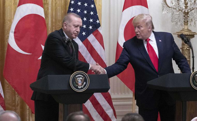 US President Donald Trump (R) shakes hands with Turkish President Recep Tayyip Erdogan during their joint press conference