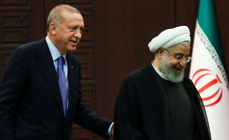 الرئيس التركي رجب طيب اردوغان ونظيره الايراني حسن روحاني