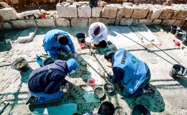 Local people and Syrian refugees work side-by-side to restore the ruins