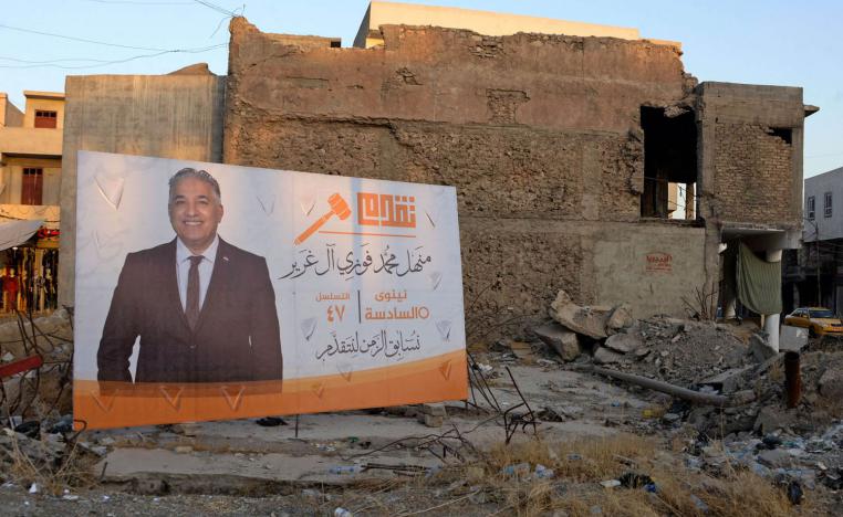 لافتة لمرشح في الانتخابات العراقية في الموصل
