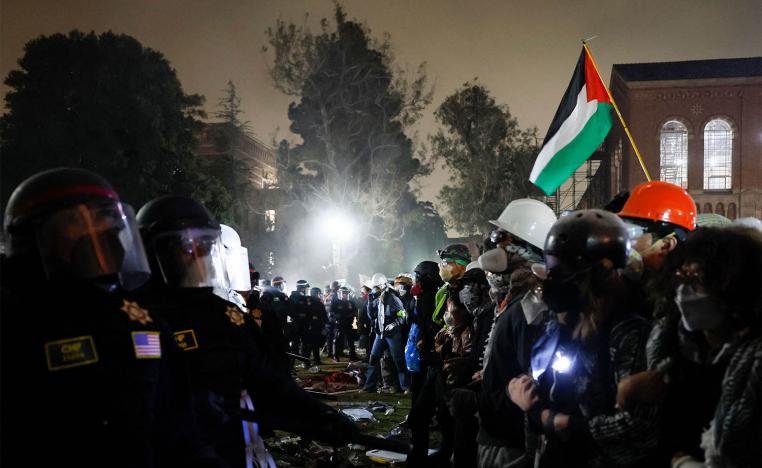 Police face-off with pro-Palestinian students after destroying part of the encampment barricade on the UCLA campus