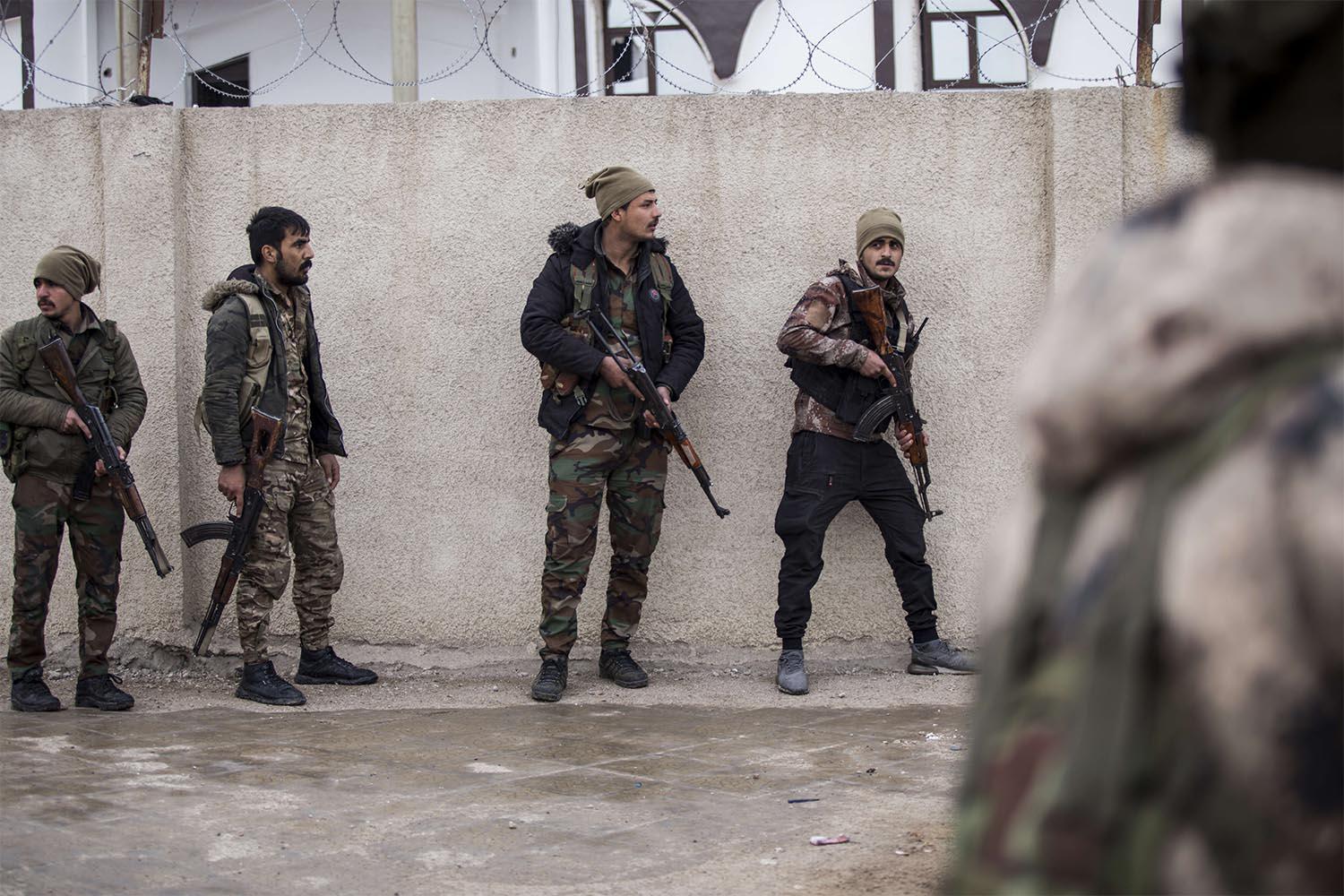 Dozens of armed Islamic State militants remained holed up in Gweiran prison