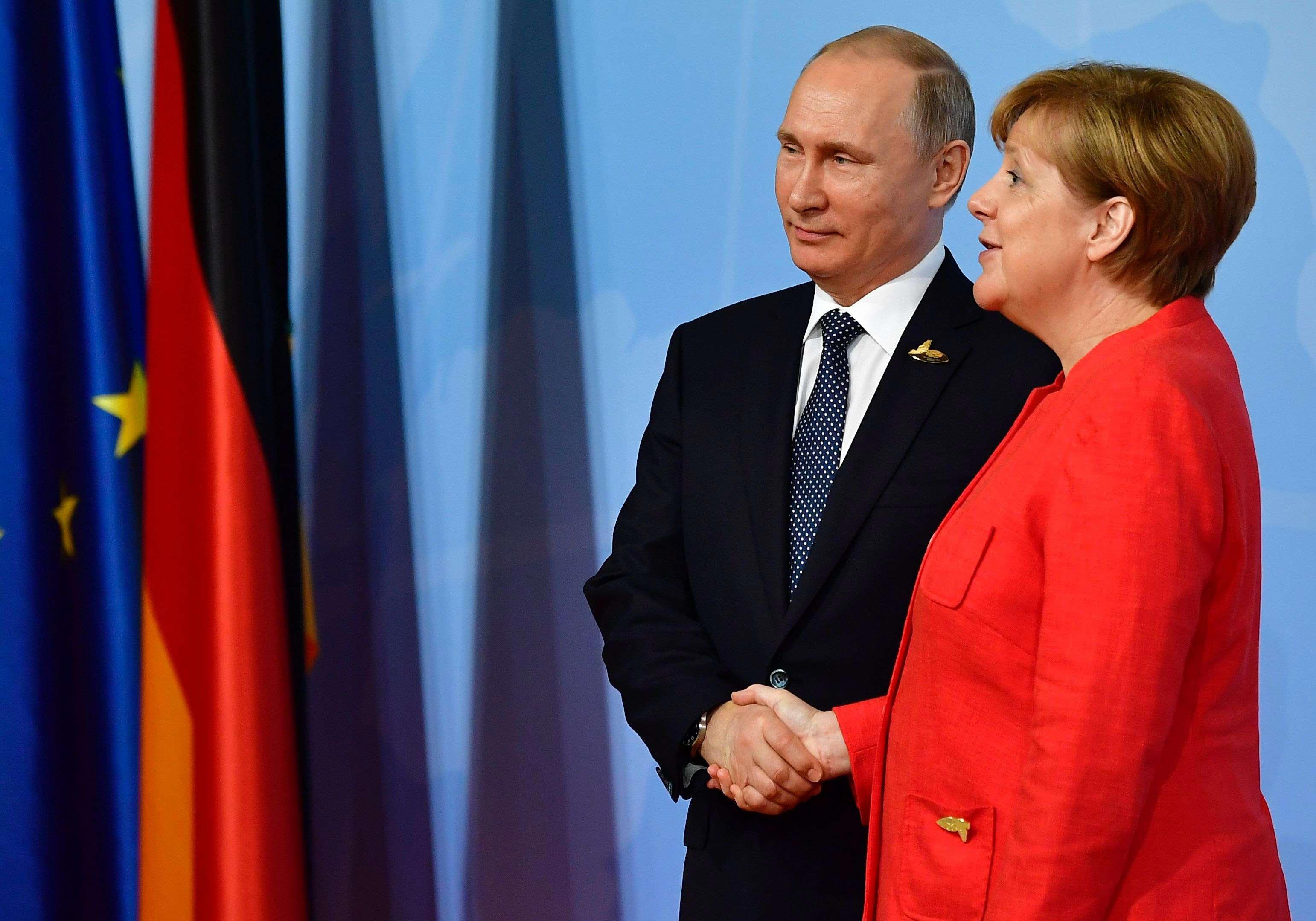 بوتين وميركل