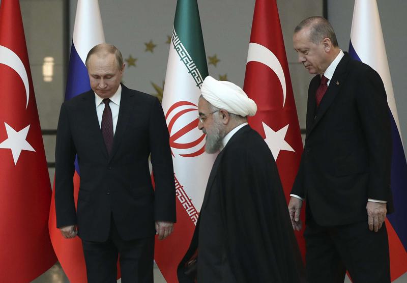  Iranian President Hassan Rohani (C), Russian President Vladimir Putin (L) and Turkish President Recep Tayyip Erdogan meet in Ankara, on April 4