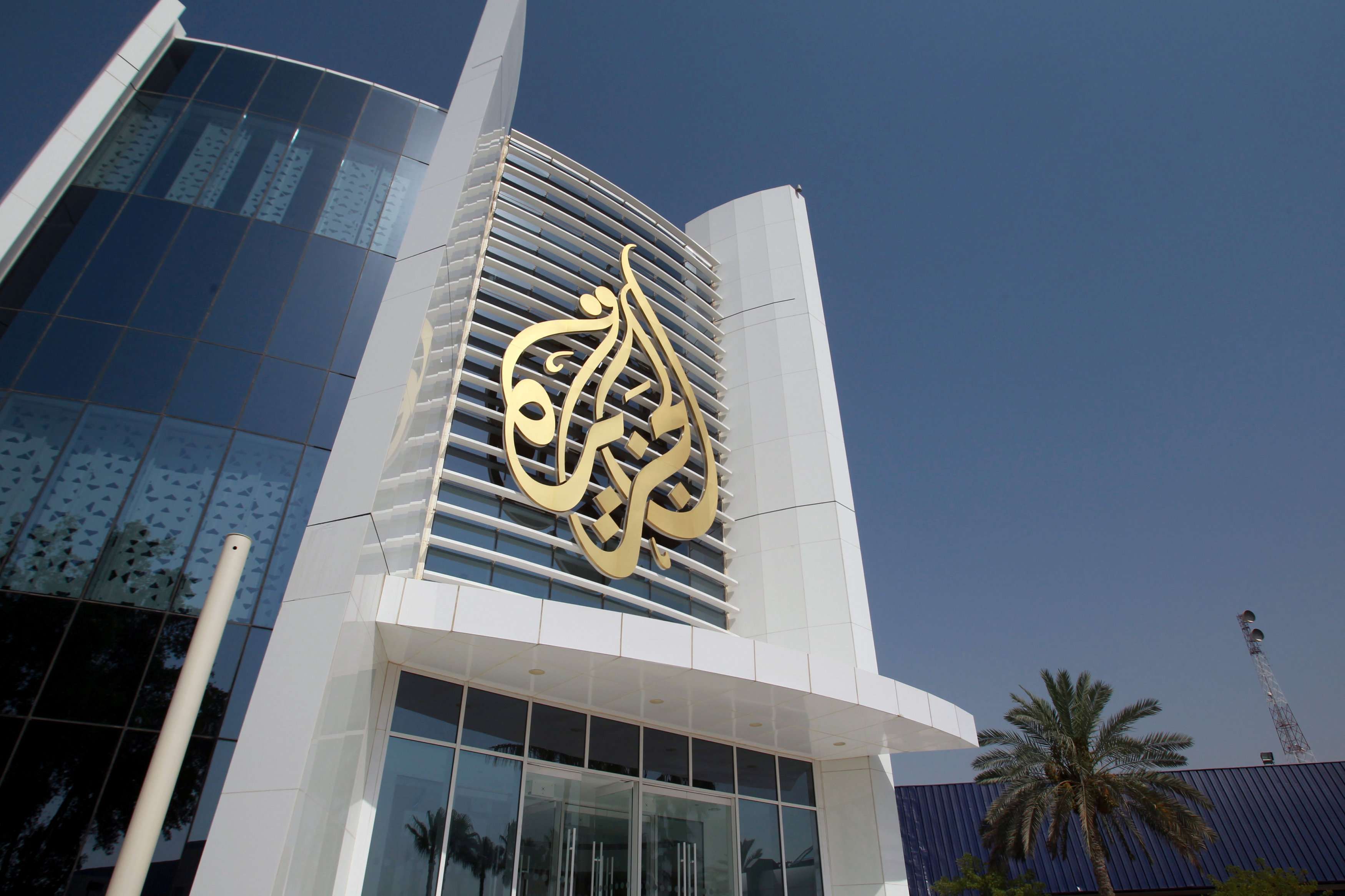 Al Jazeera Media Network logo is seen on the channel's headquarters building in Doha, Qatar on June 8, 2017.