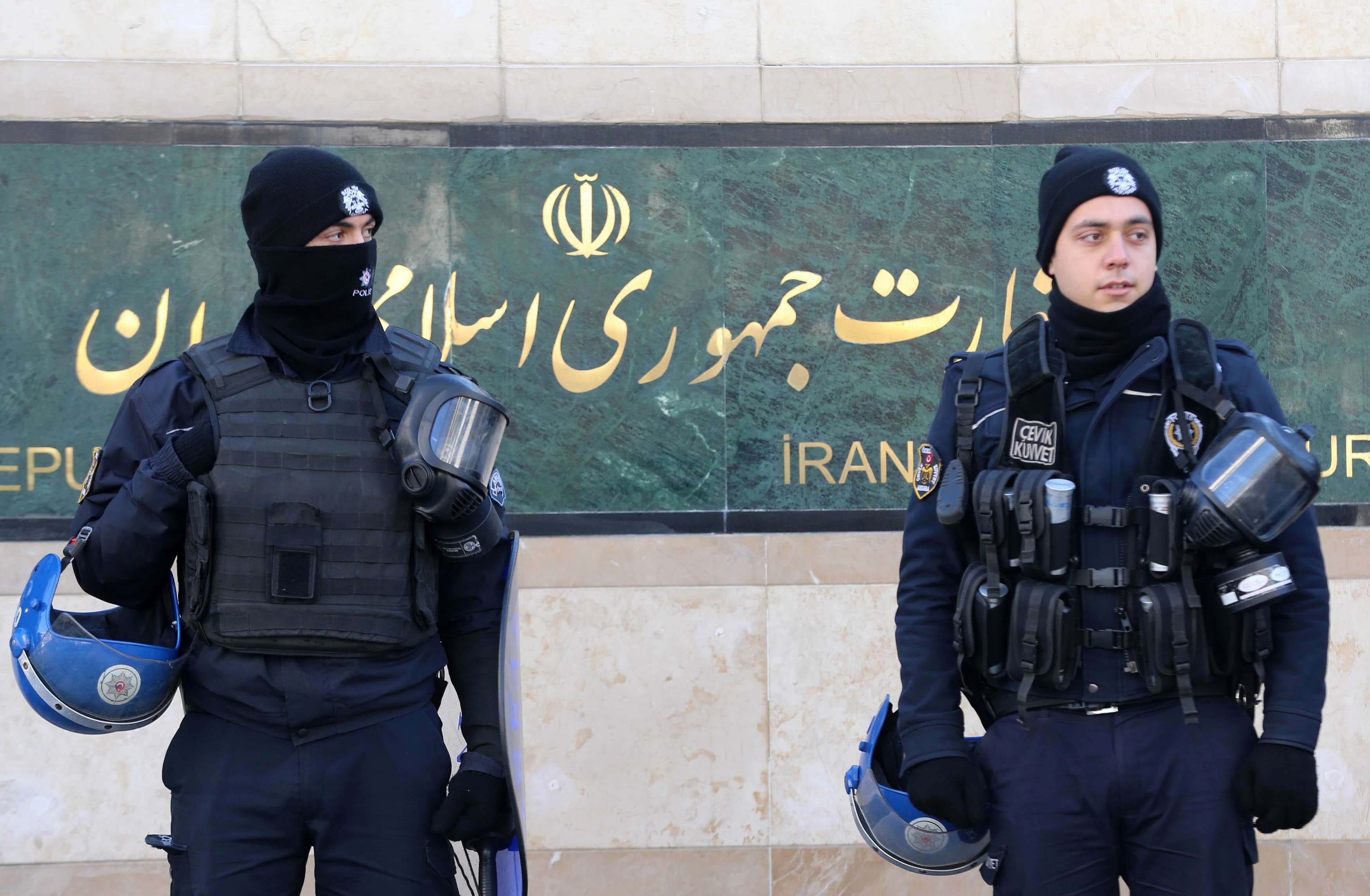 Turkish riot police stand guard in front of the Iranian Embassy during a protest against Iran's role in Aleppo, in Ankara, on December 15, 2016