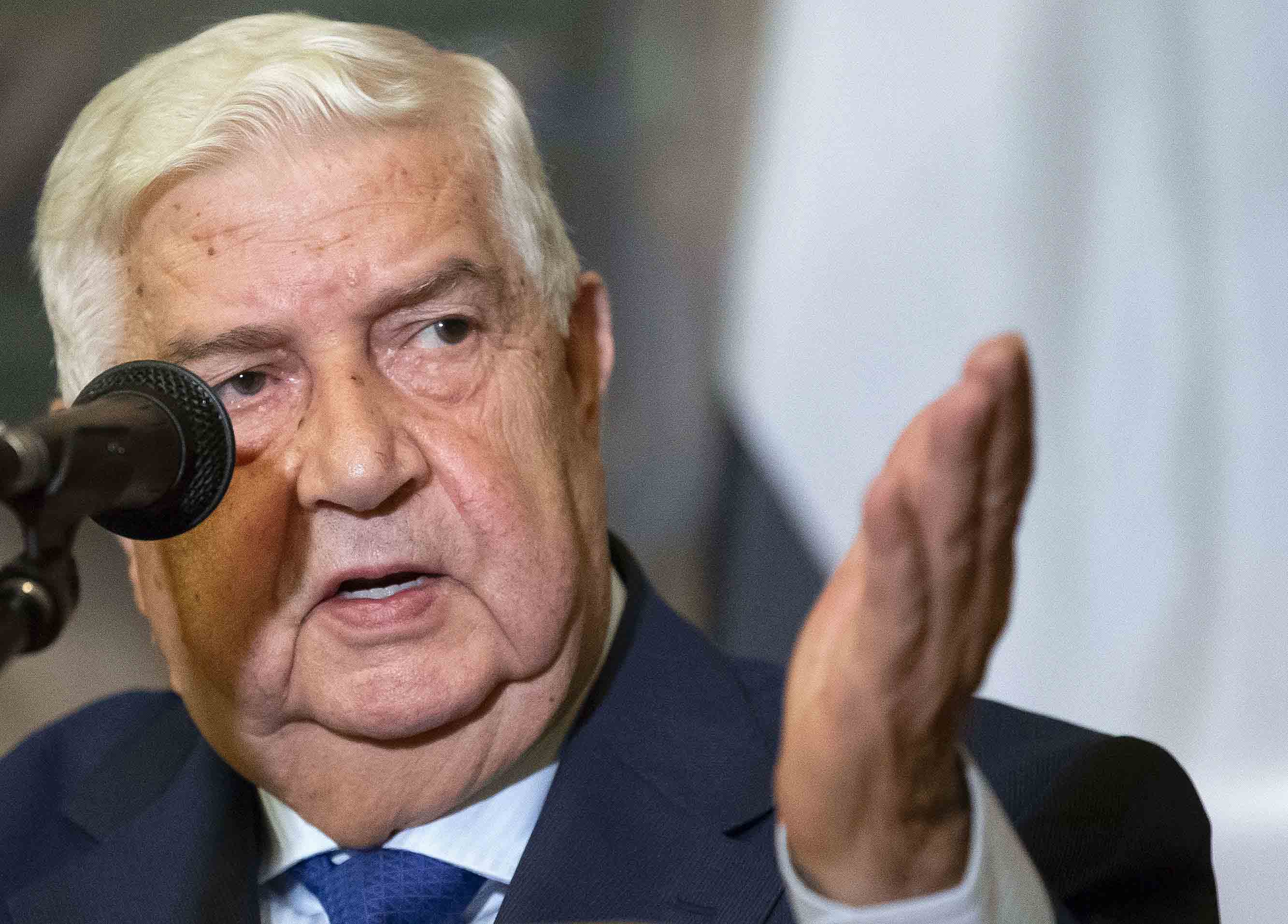 Syrian Foreign Minister Walid Muallem gestures as speaks to the media during the joint news conference with Russian Foreign Minister Sergey Lavrov, following their talks, in Moscow, Russia, Thursday, Aug. 30, 2018