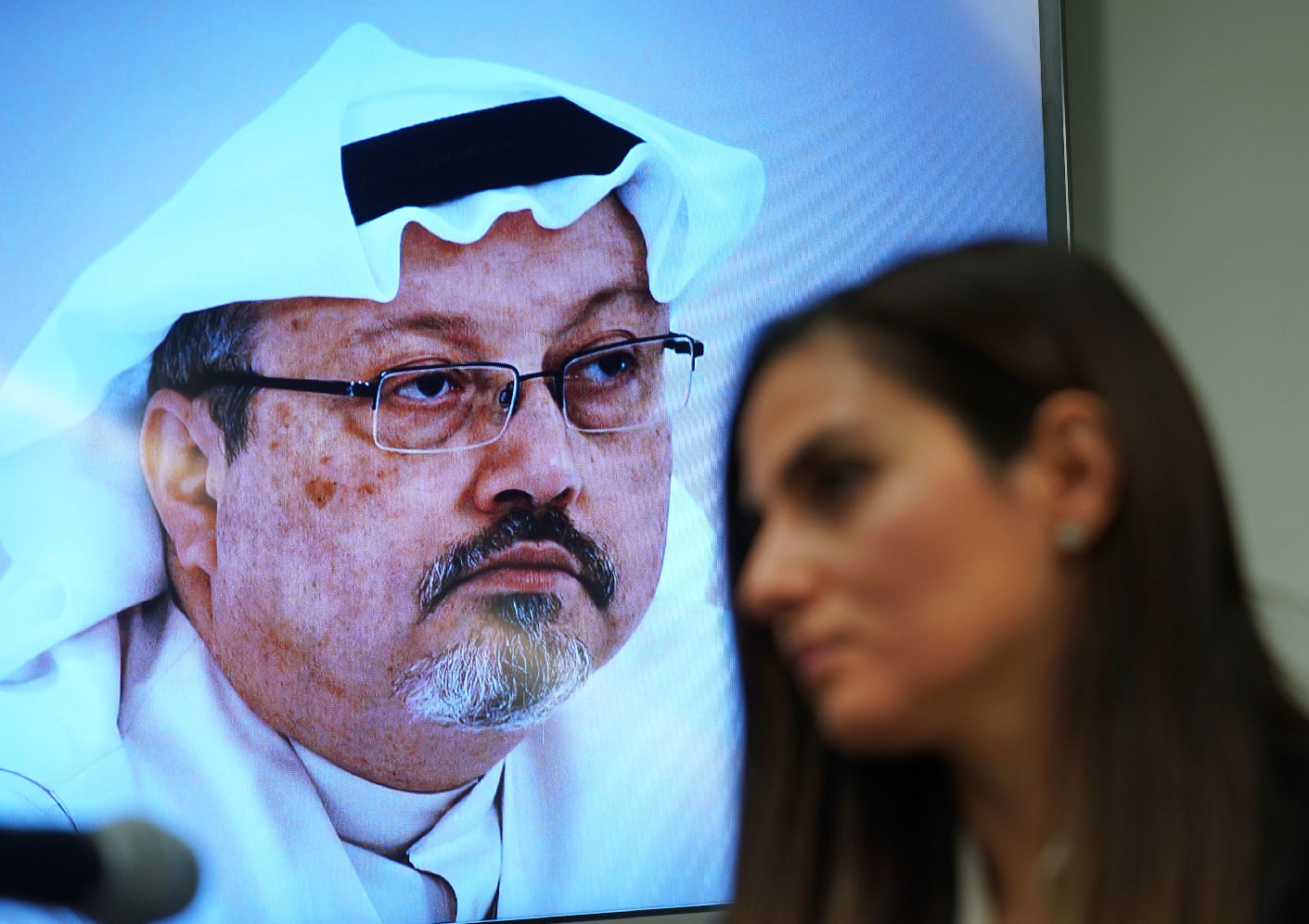 Sherine Tadros, head of New York (UN) Office of Amnesty International, speaks in front of a picture of Jamal Khashoggi during a news conference at the United Nations.