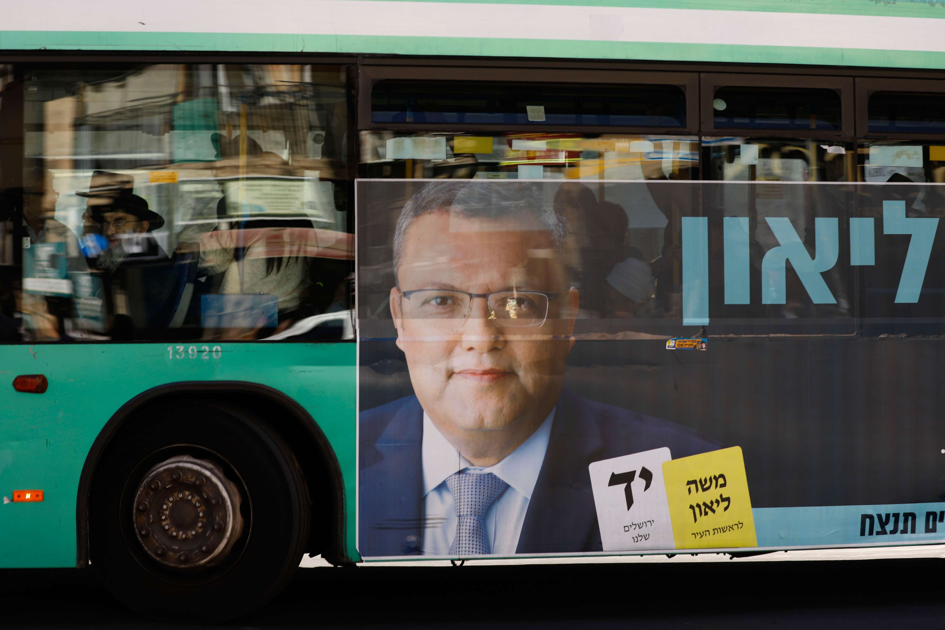 A campaign poster of municipal candidate Moshe Lion on a bus ahead of the upcoming Jerusalem municipal elections, in Jerusalem.