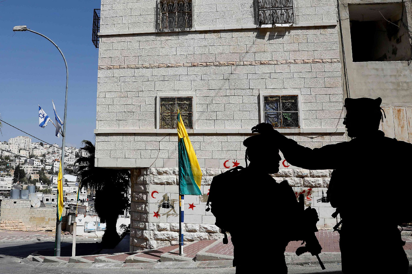 Israeli soldiers patrol near the Jewish neighborhood in the city of Hebron in the occupied West Bank on October 14, 2018.