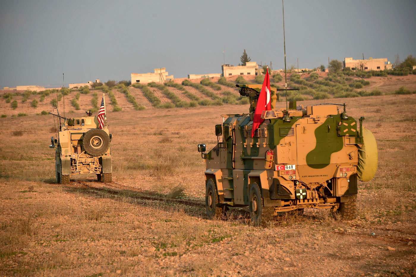 Turkish and U.S. troops are pictured during a joint patrol in Manbij area, northern Syria November 8, 2018.