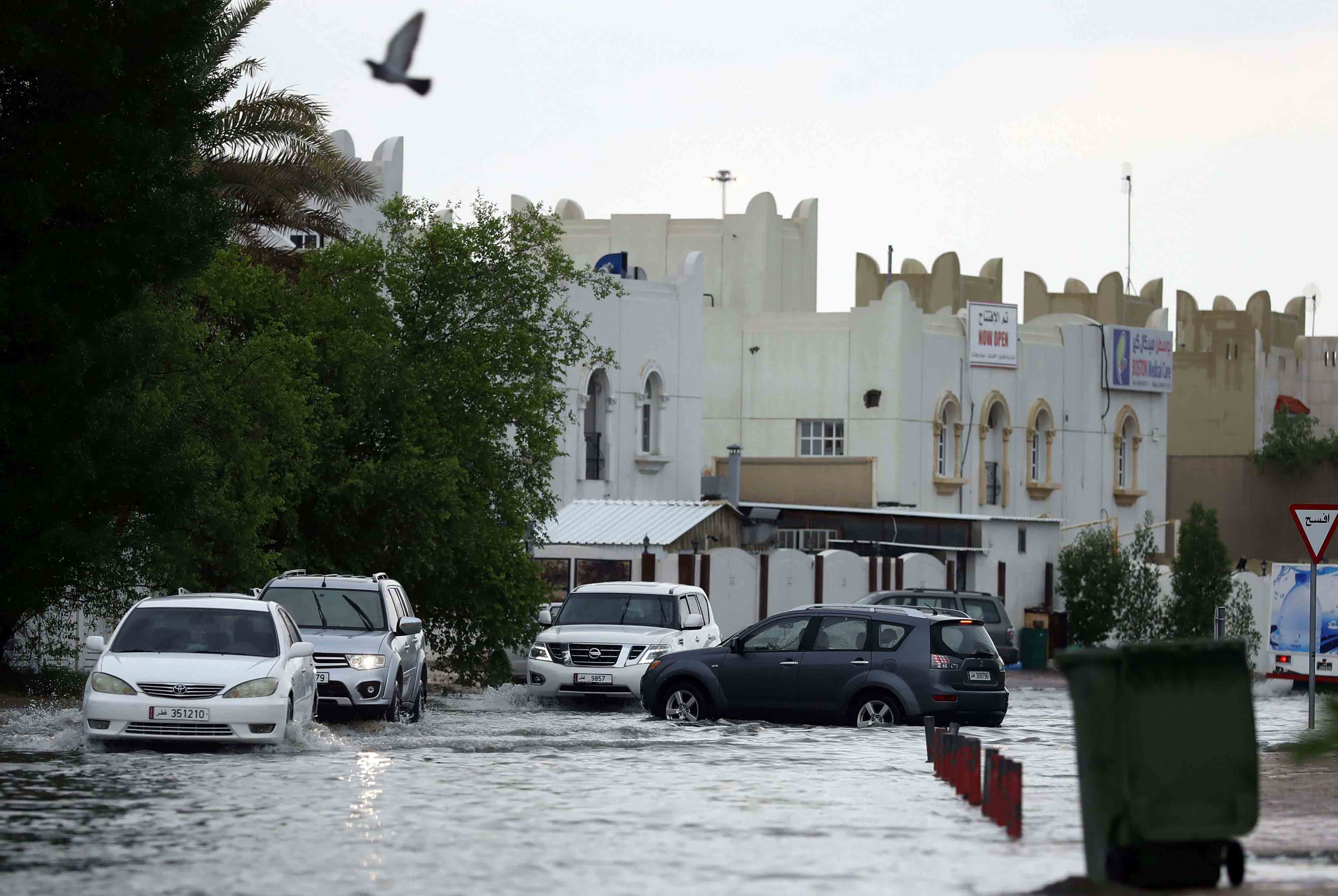 Roads flooded and workers were seen mopping up inside office buildings