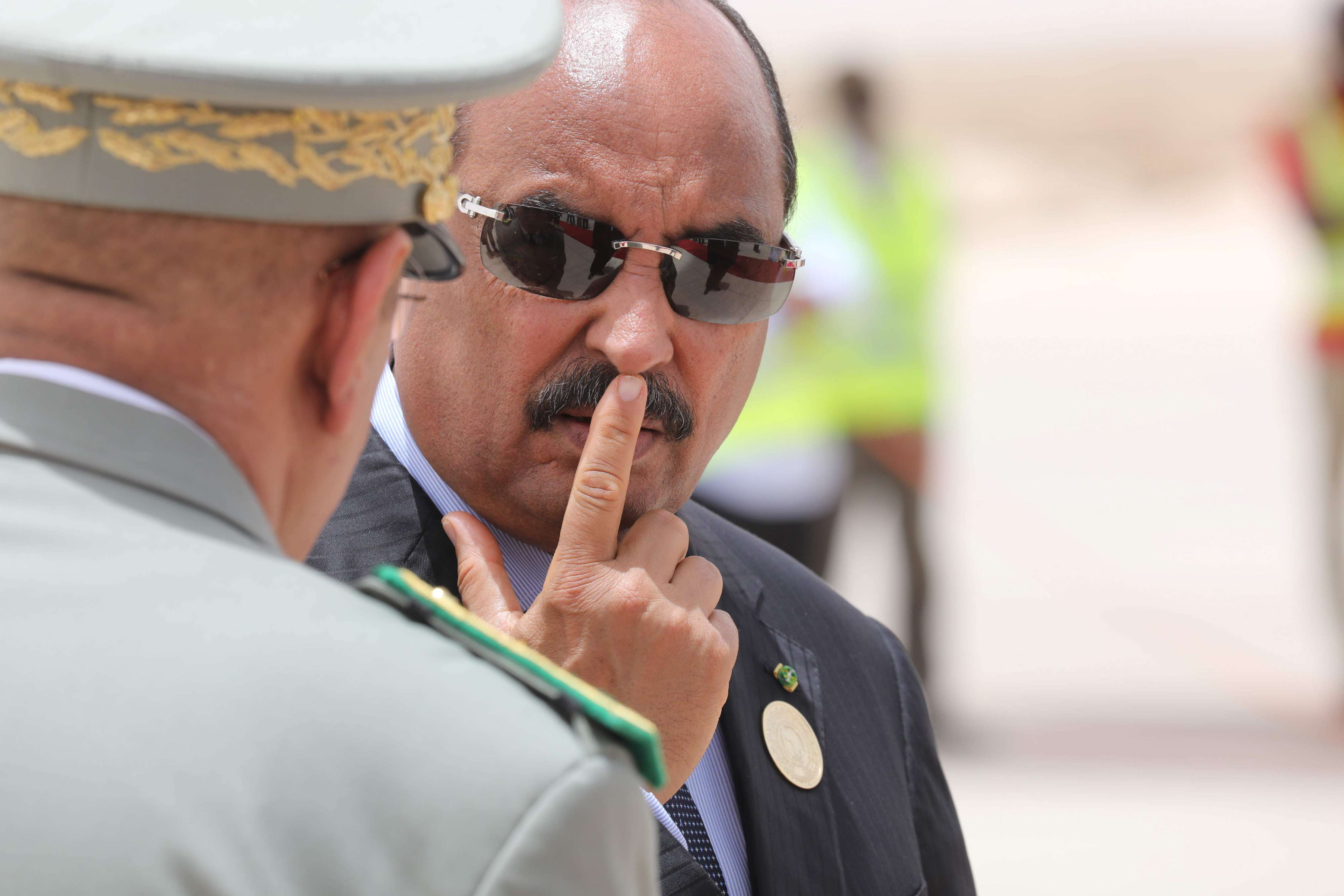 Mauritanian President Mohamed Ould Abdel Aziz waits for the arrival of the French President at Nouakchott airport on July 2, 2018.