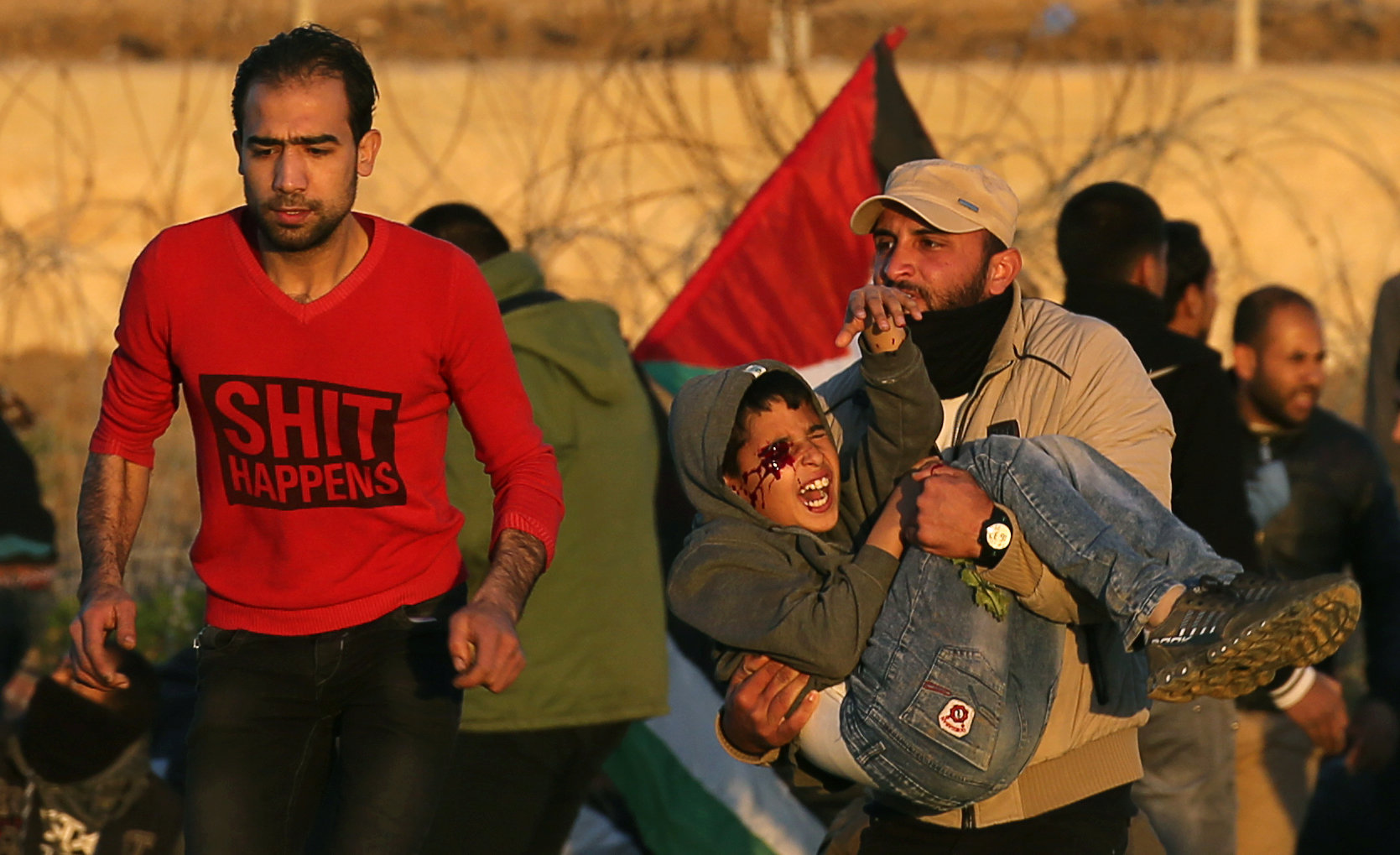 A wounded Palestinian boy is evacuated during a protest at the Israel-Gaza fence, in the southern Gaza Strip January 11, 2019.