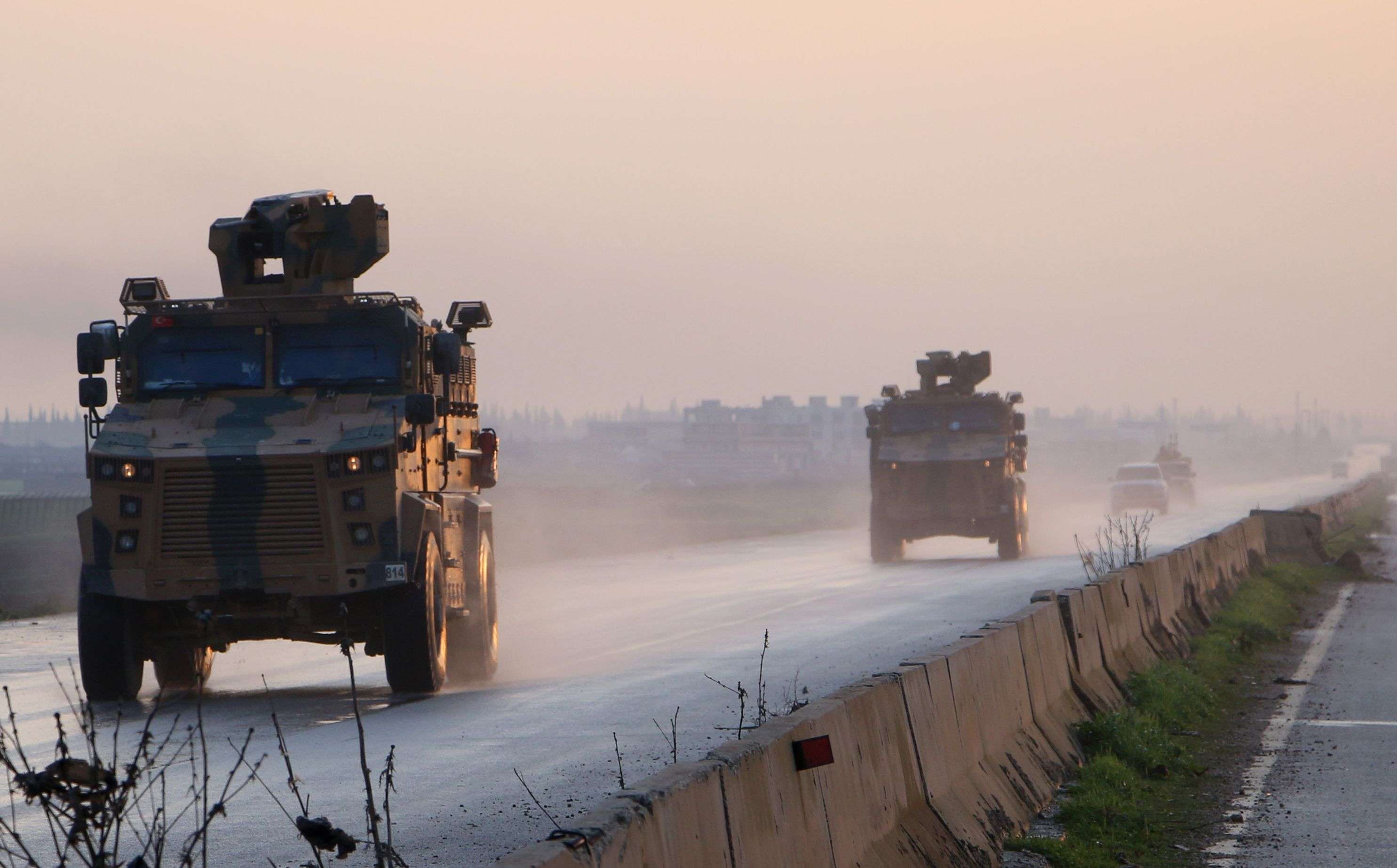 Turkish military vehicles on a road in Syrian second city Aleppo's southwestern countryside on Dec. 31, 2018.