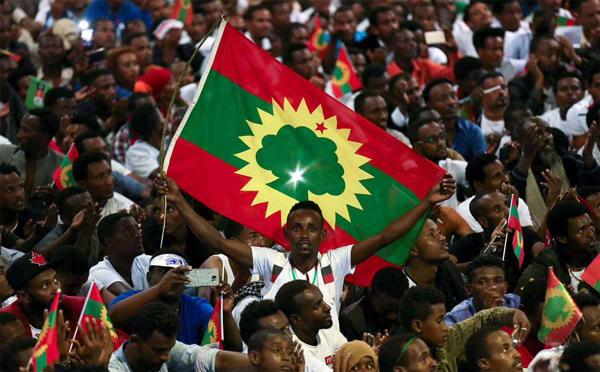 A man holds an Oromo Liberation Front (OLF) flag 