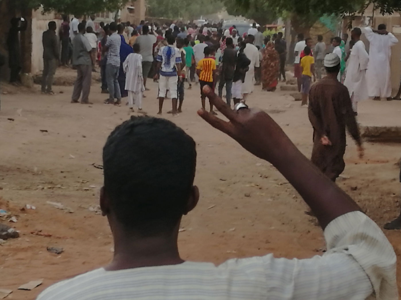 A Sudanese protester raises the victory sign during an anti-government demonstration in Khartoum on February 15, 2019.
