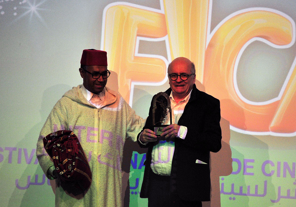 Didier Brunner (R) receiving the honourary award