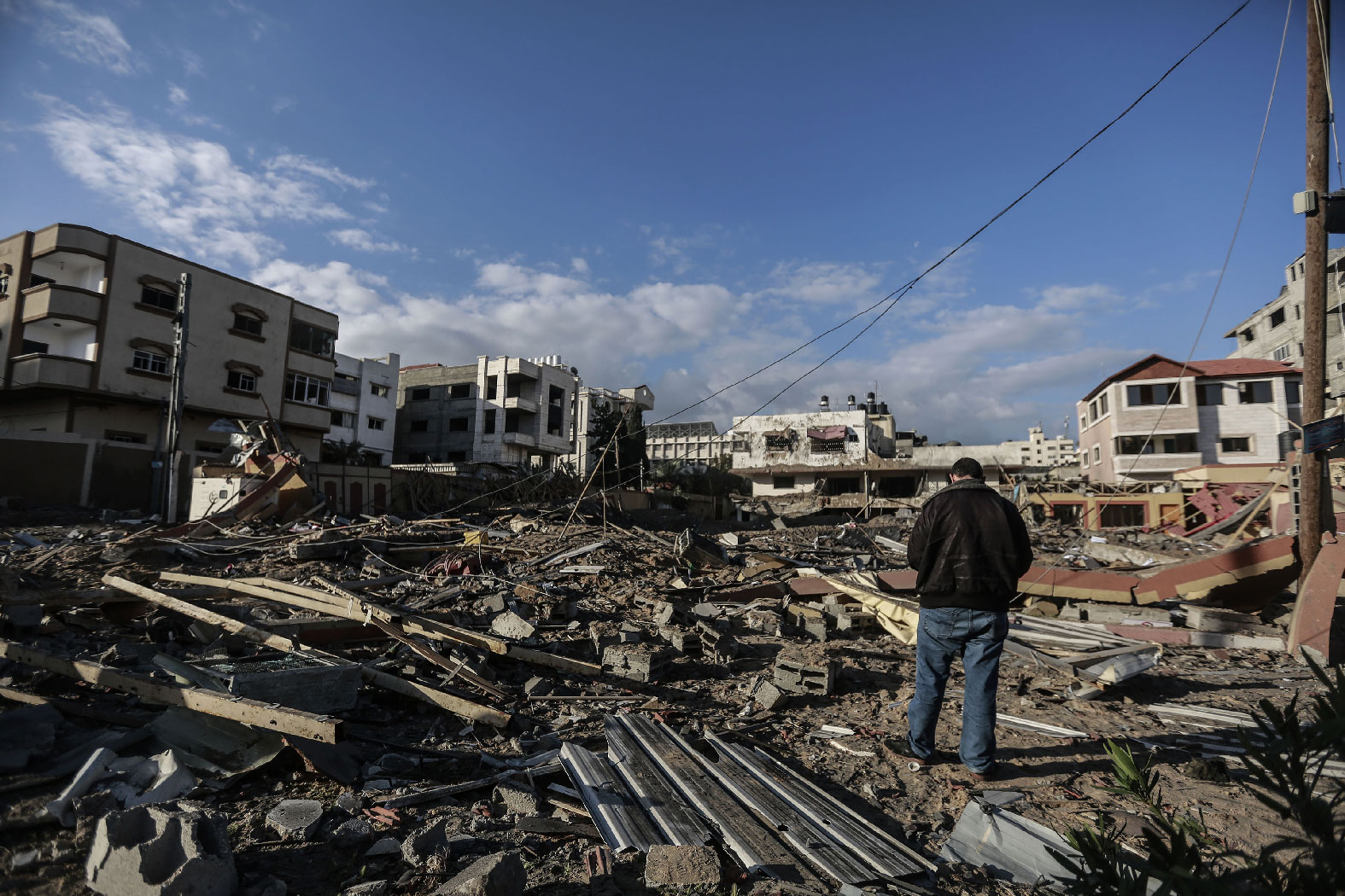 26 March 2019, Palestinian Territories, Gaza City: A Palestinian inspects remains, after strikes carried out by the Israeli army, that began targeting Hamas sites throughout the Gaza Strip.