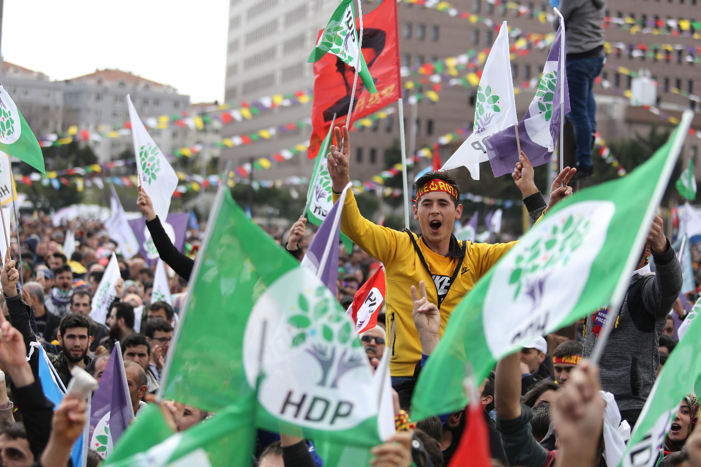 People wave pro-Kurdish Peoples' Democratic Party (HDP) flags during a gathering to celebrate Nowruz, which marks the arrival of spring and the new year, in Istanbul, Turkey March 24, 2019.