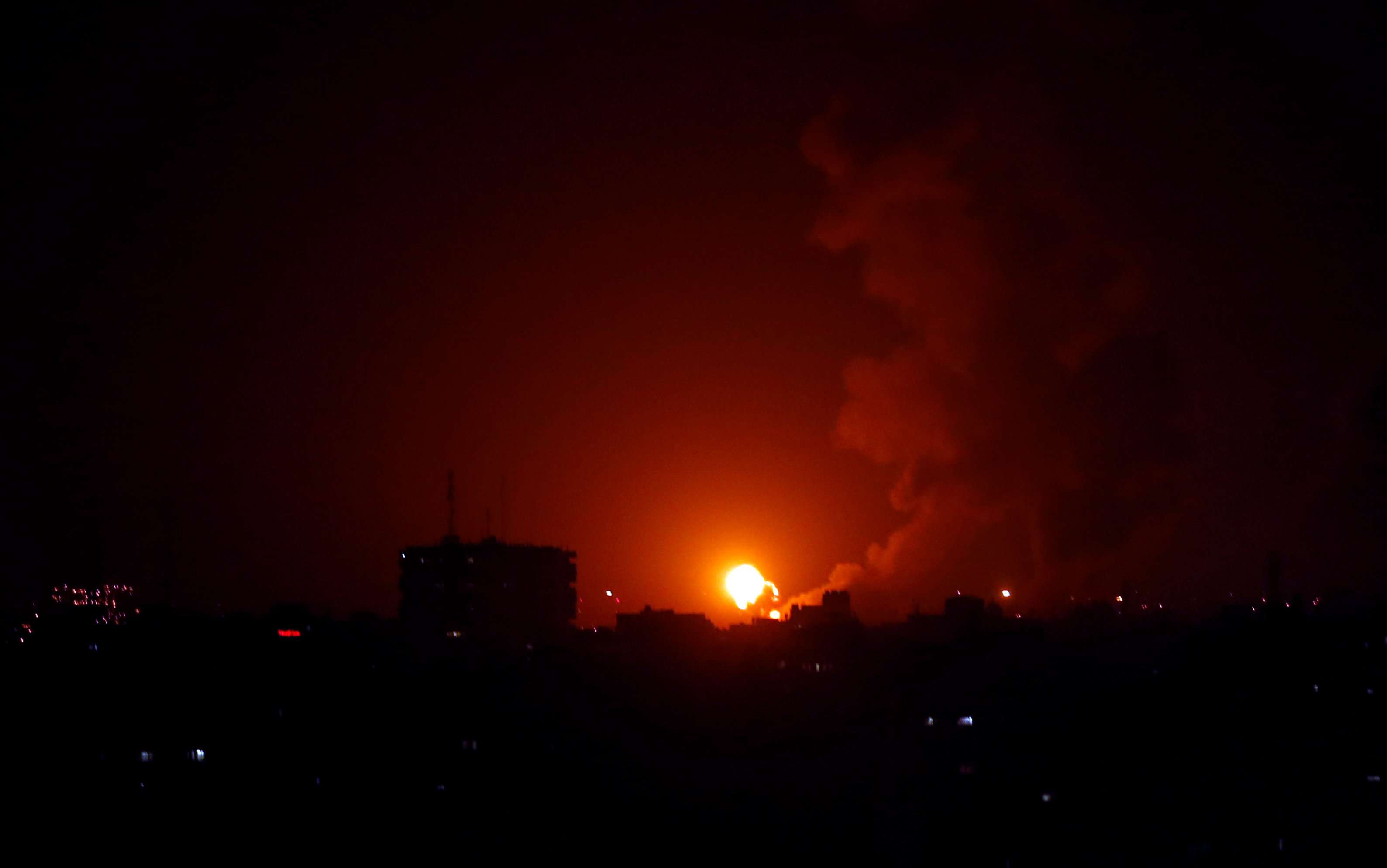 An explosion is seen during Israeli air strikes in Gaza January 22, 2019.