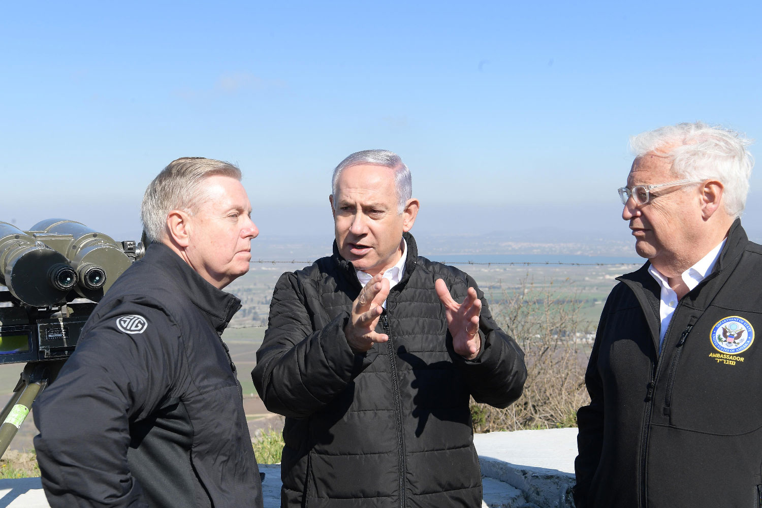 Israeli Prime Minister Benjamin Netanyahu (C), US Ambassador in Israel David Friedman (R) and US Senator Lindsey Graham visit the Golan Heights.