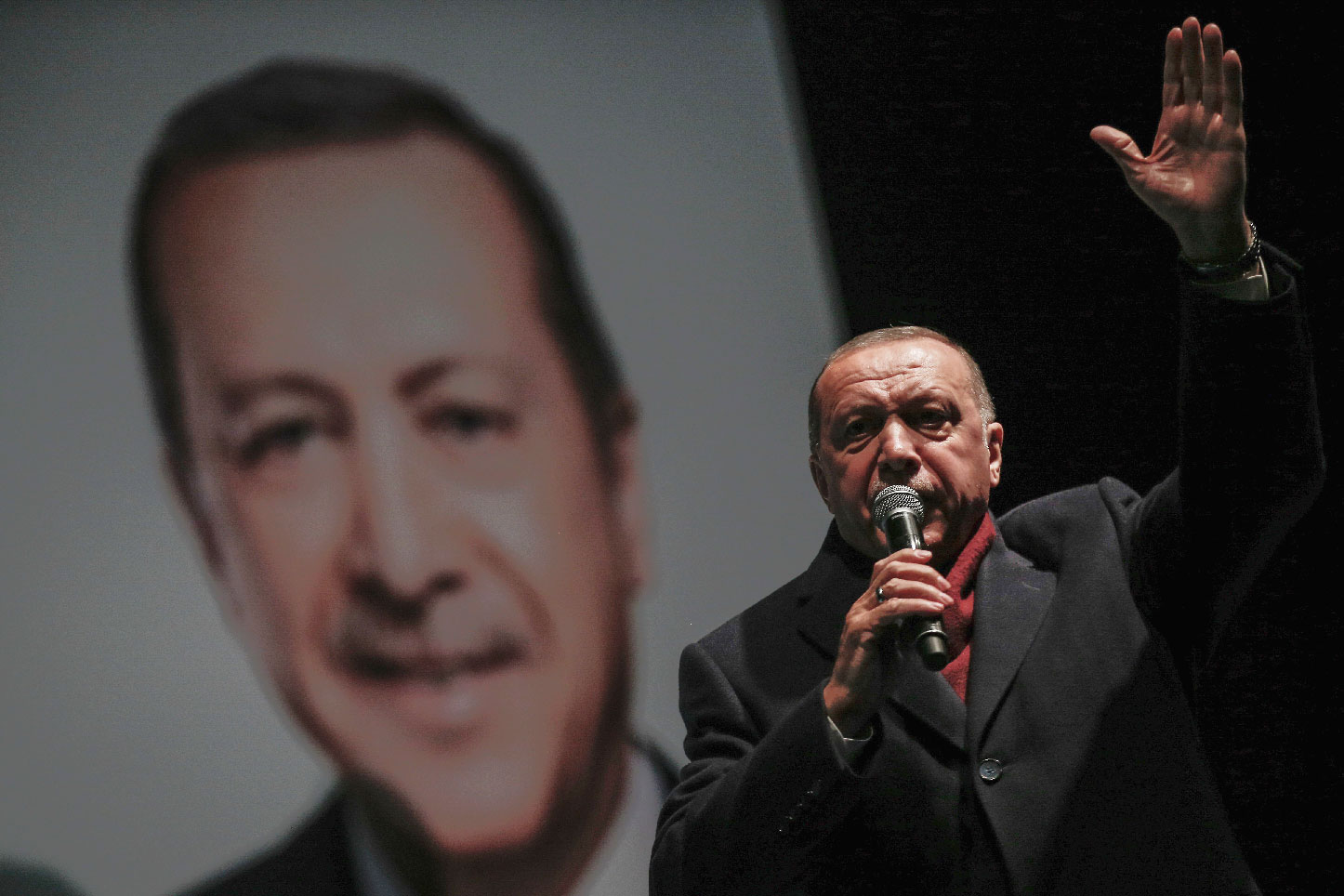 Turkey's President Recep Tayyip Erdogan addresses the supporters of his ruling Justice and Development Party, AKP, at a rally in Istanbul, late Tuesday, March 19, 2019, ahead of local elections scheduled for March 31, 2019.