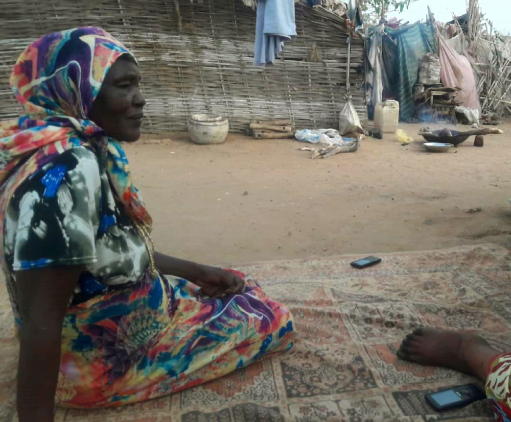 Kahdija, the daughter of Hawwa Yousef, sits in Kalma camp outside South Darfur state capital Nyala