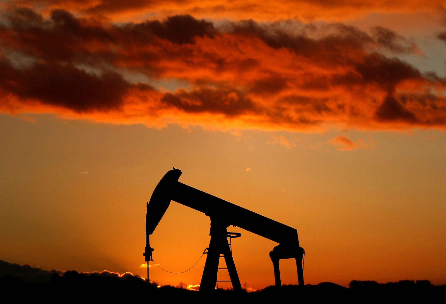 Oil pump is seen at sunset outside Scheibenhard, near Strasbourg, France, October 6, 2017 . 