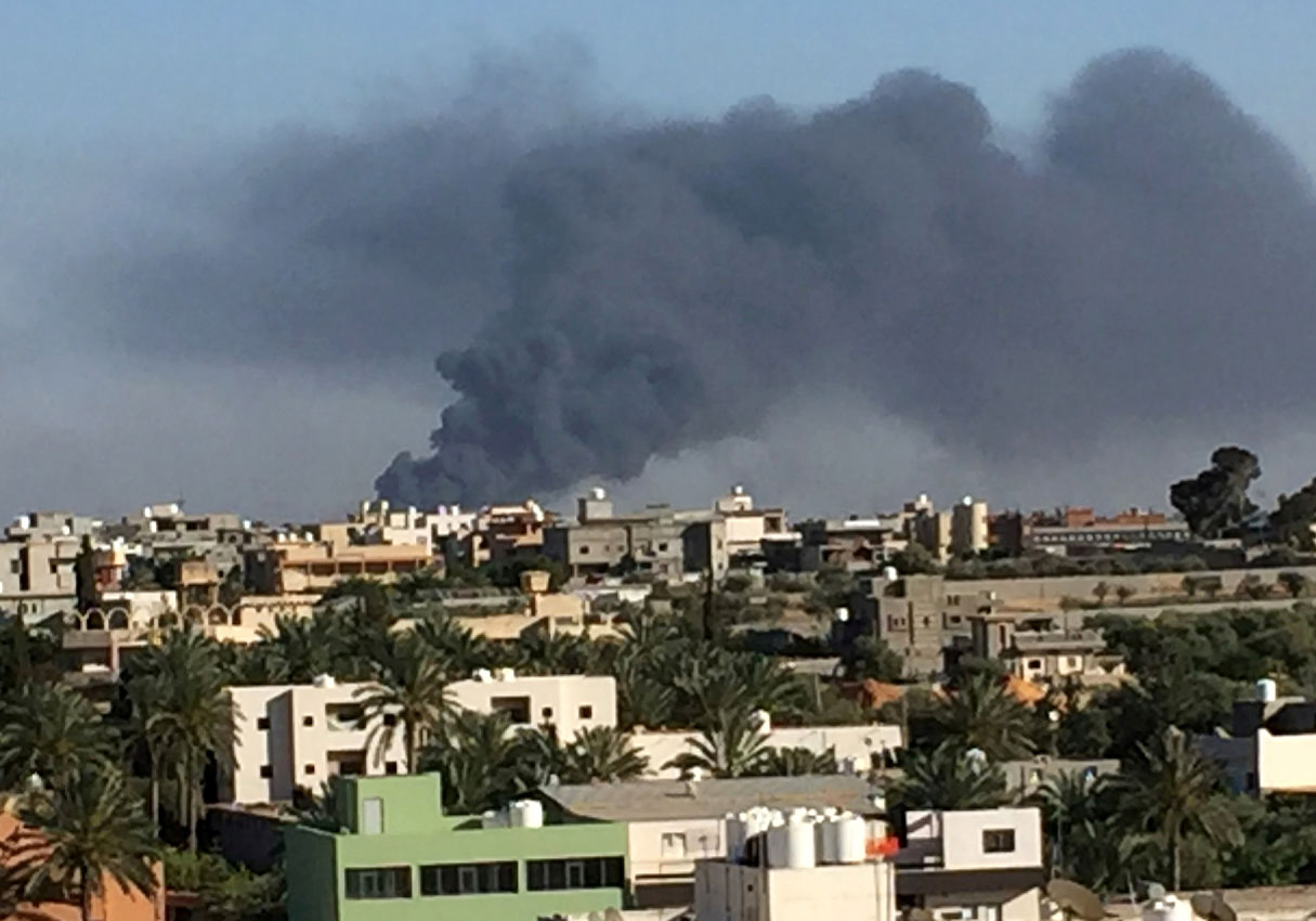 Smoke rises during fighting in Ain Zara, Tripoli