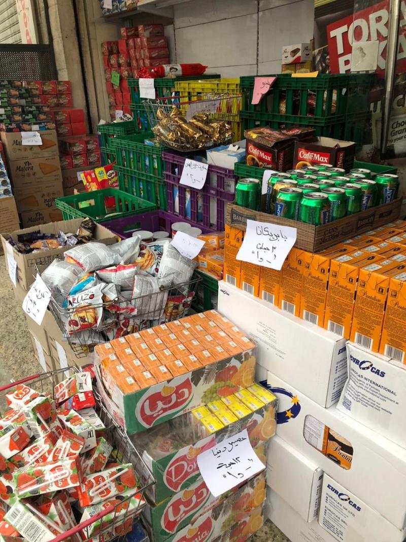 Food products nearing expiry on display at a market in Amman