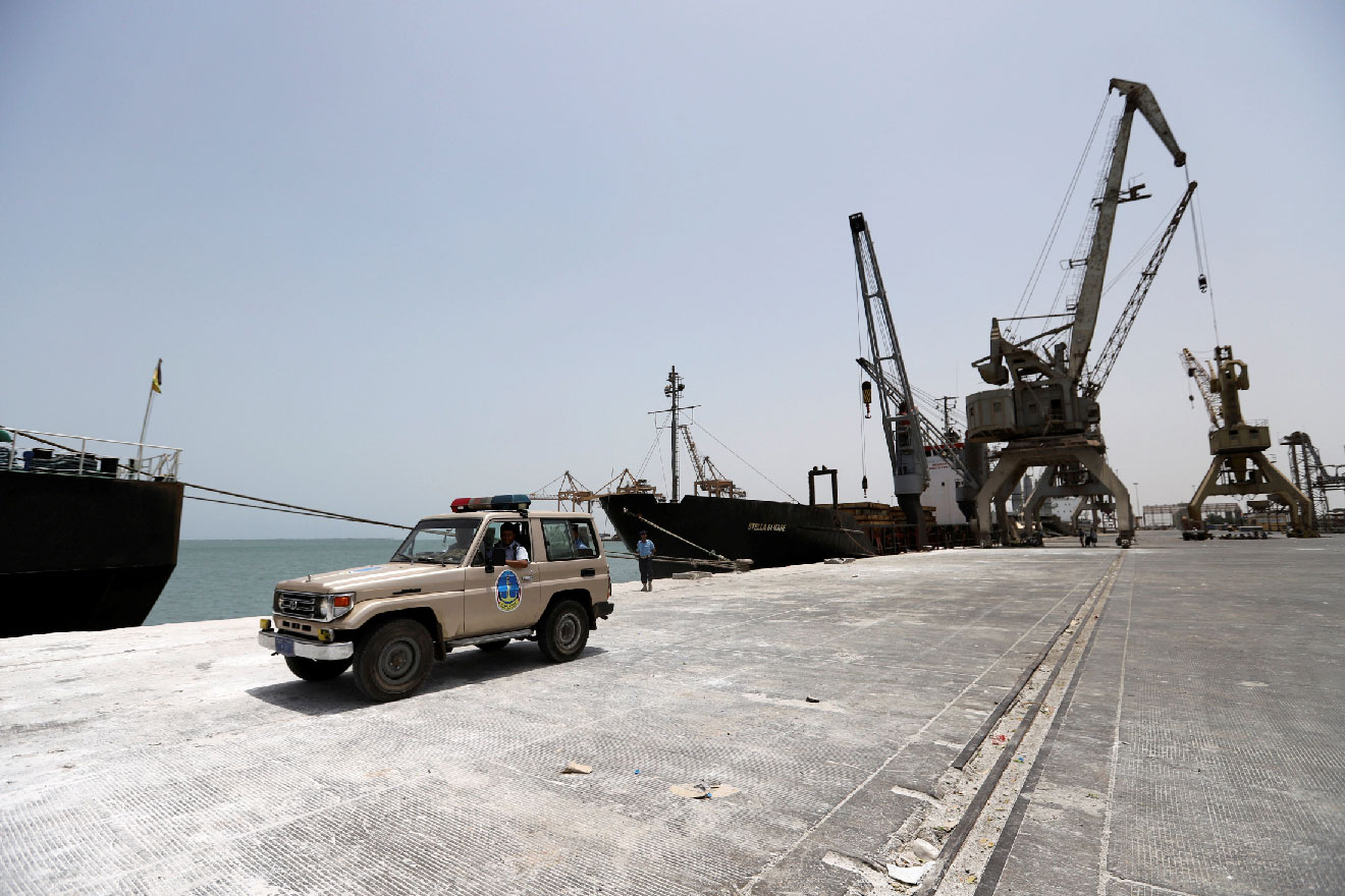 Yemeni local coast guards drive a car after their deployment at Hodeidah port