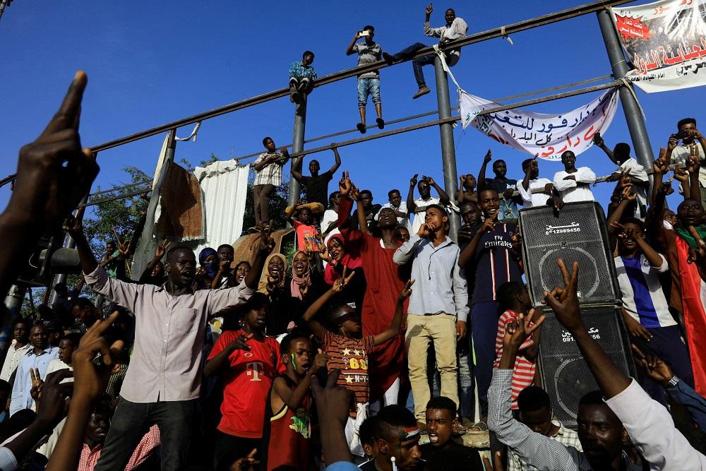 Hundreds walk each morning along the major boulevard that runs alongside the compound, the epicentre of the demonstrations that led to Bashir's downfall