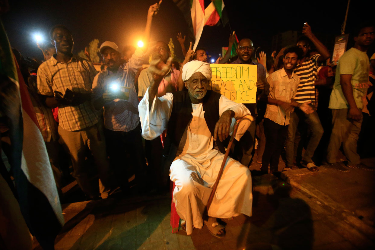 Sudanese protesters gather during a demonstration outside military headquarters in Khartoum