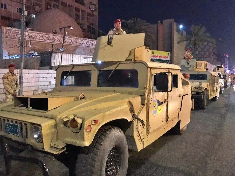 Iraqi security forces stand guard near Bahraini embassy in Baghdad