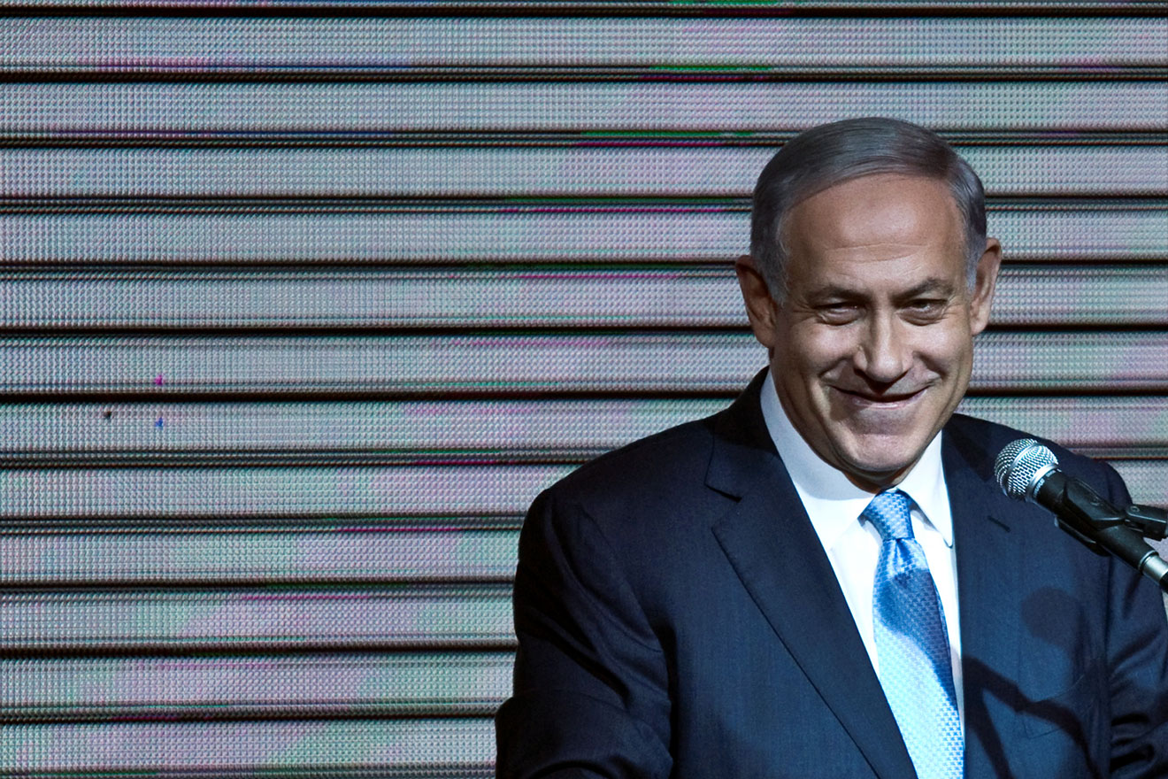 Israeli Prime Minister Benjamin Netanyahu delivers a speech to supporters at his party headquarters in Tel Aviv