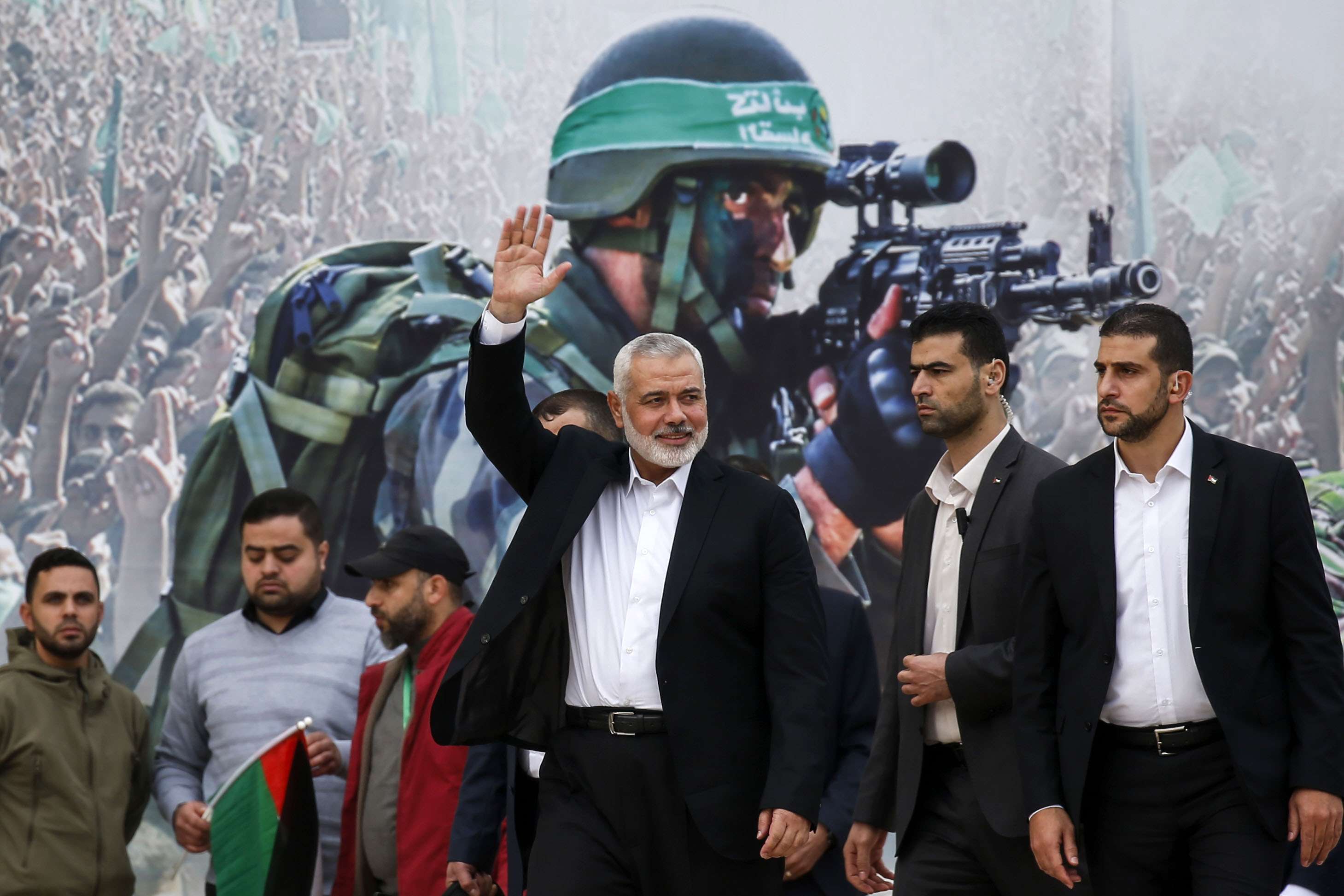 Gaza Hamas leader Ismail Haniya waves upon his arrival at a rally marking the 31st anniversary of Hamas' founding