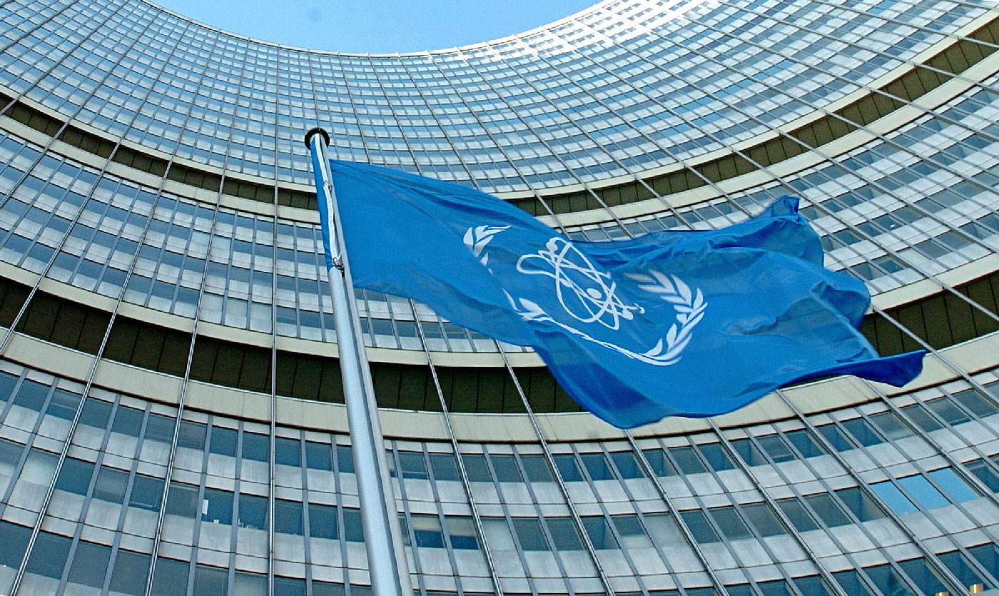 The IAEA flag flatters in the wind in front of the International Atomic Energy Agency headquarters in UN city in Vienna