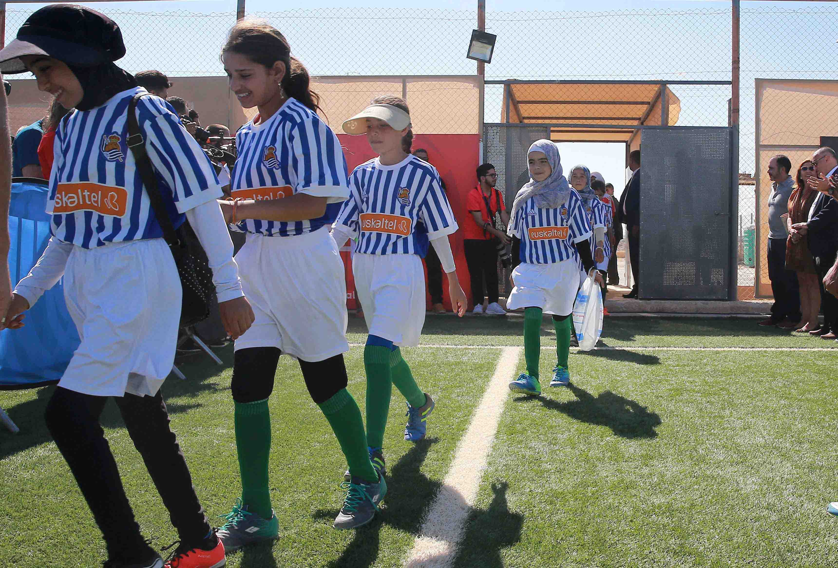 Children at Zaatari Refugee Camp wear jerseys of their favourite Spanish teams to celebrate being part of La Liga Zaatari Social Project