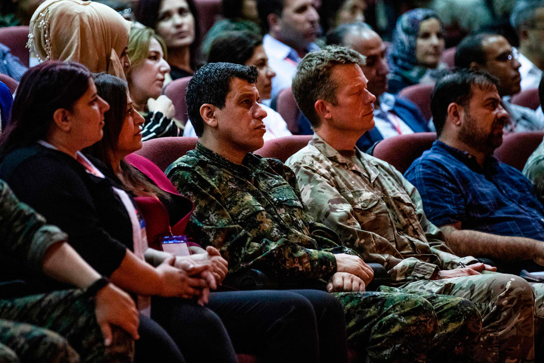 Mazloum Kobani (3rd-L), commander-in-chief of the Syrian Democratic Forces (SDF), and Brigadier-General Nicholas Pond (2nd-R), a representative of the US-led coalition