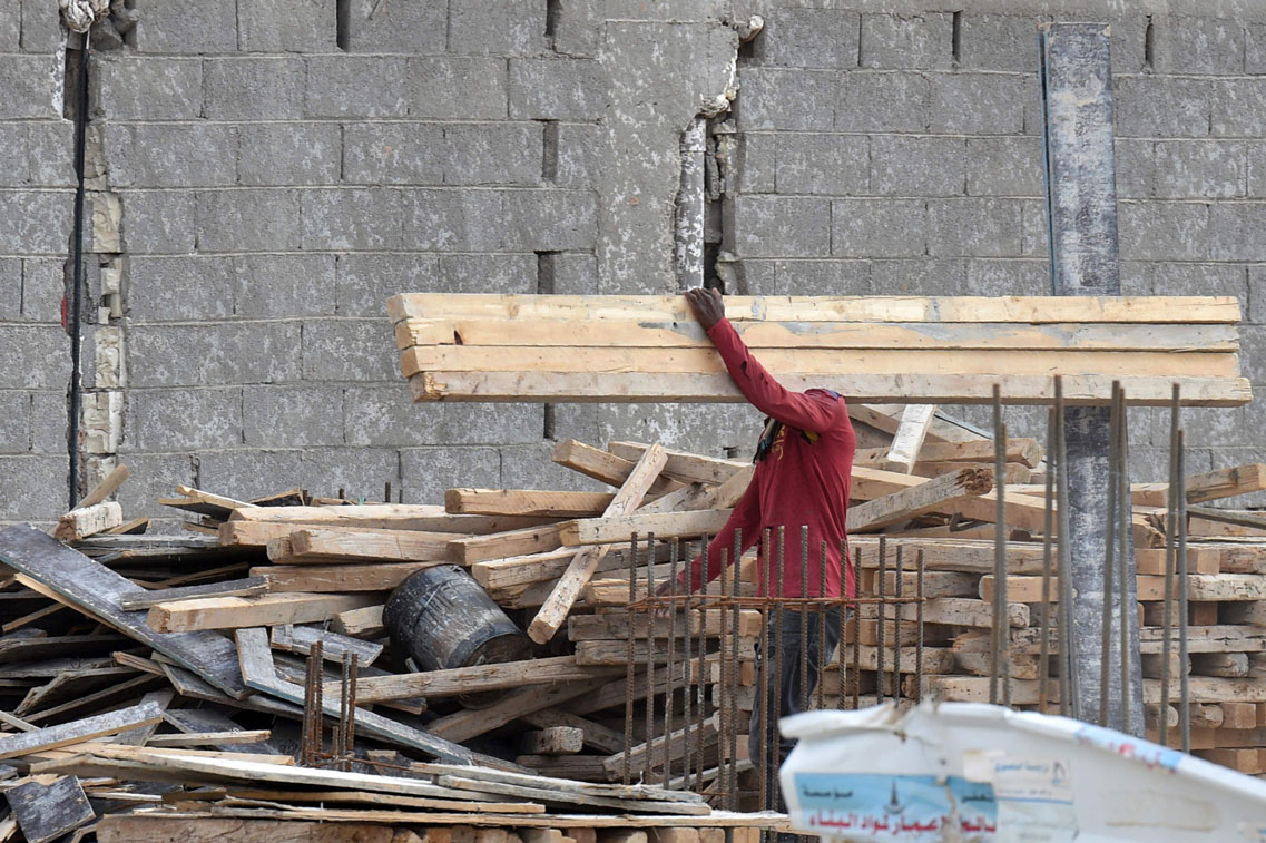 A foreign labourer works on the construction of a house in the Saudi capital Riyadh