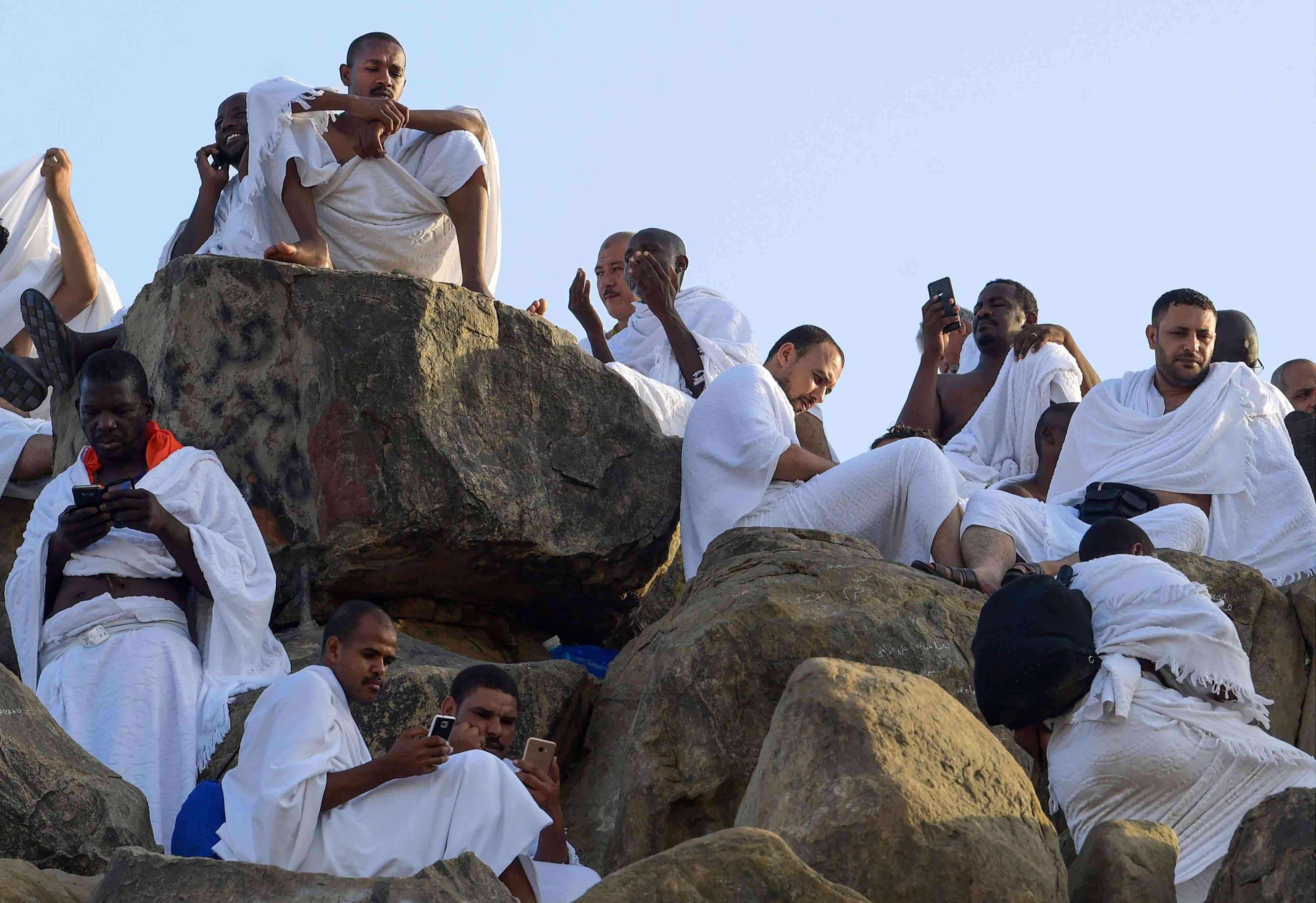 At the peak of Mount Arafat, numerous Muslim pilgrims were absorbed in Koranic verses displayed on their smartphones