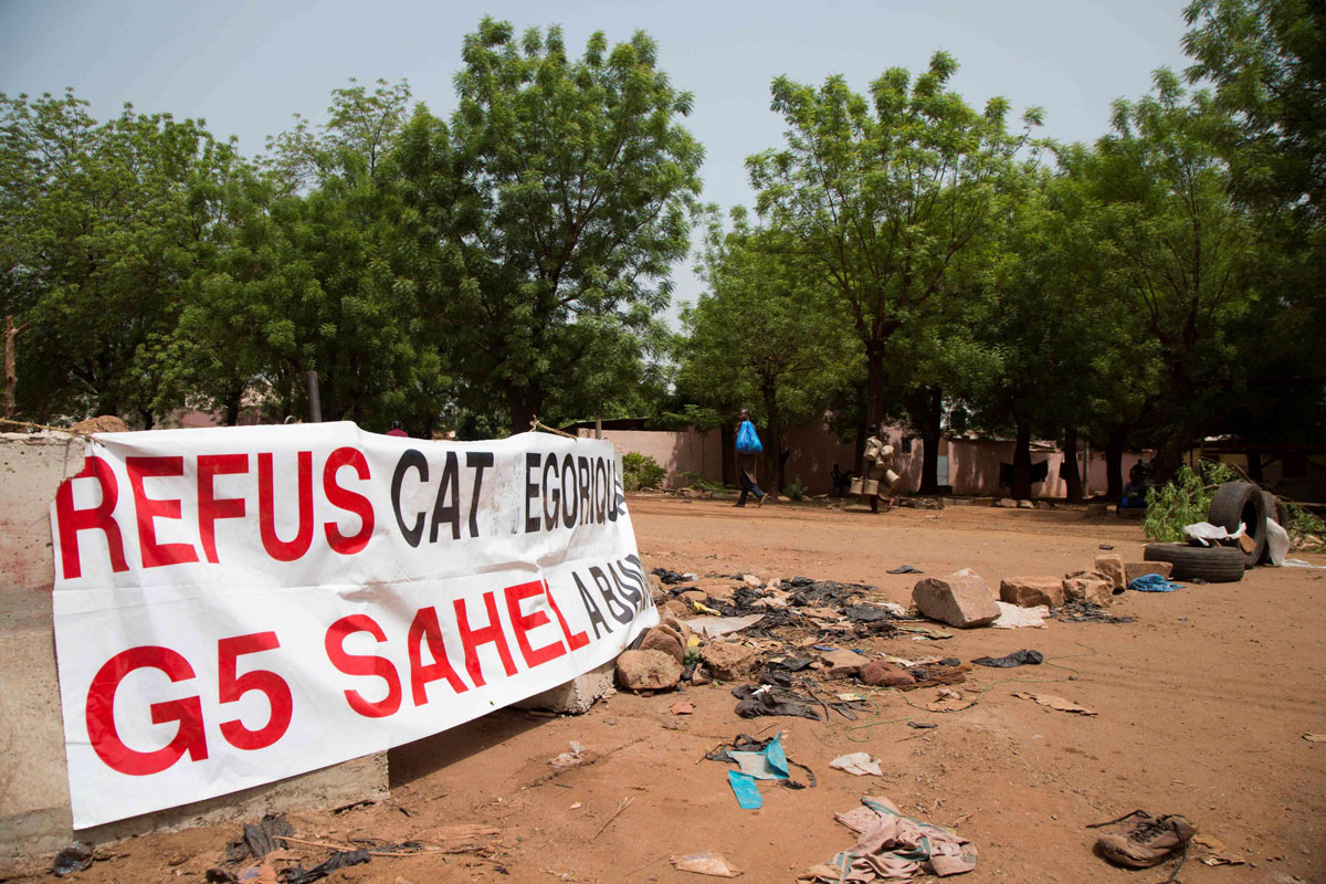 Tires block the road on May 23, 2019 in front of the new headquarters of the G5 Sahel