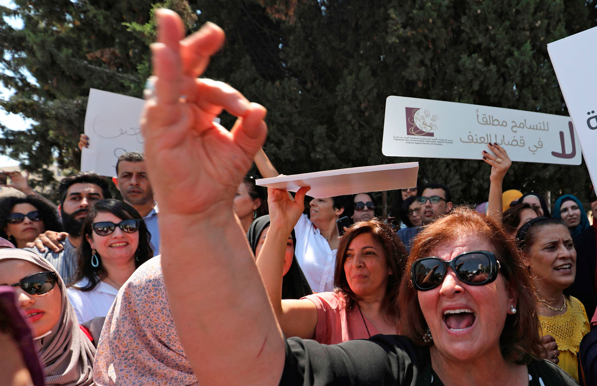 Palestinian women protest in support of women's rights outside the prime minister's office in Ramallah