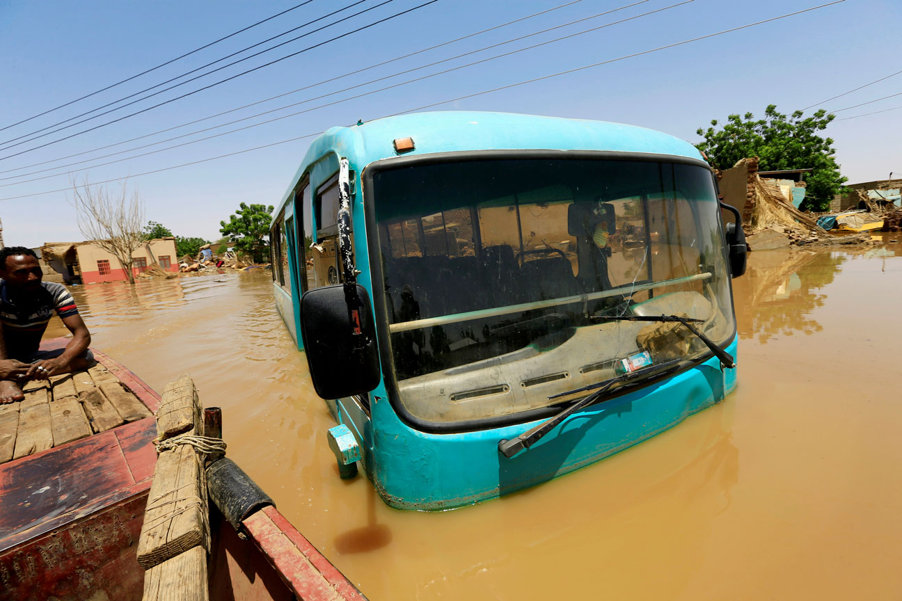 A truck is seen in a flood near the River Nile in Khartoum localities, Sudan