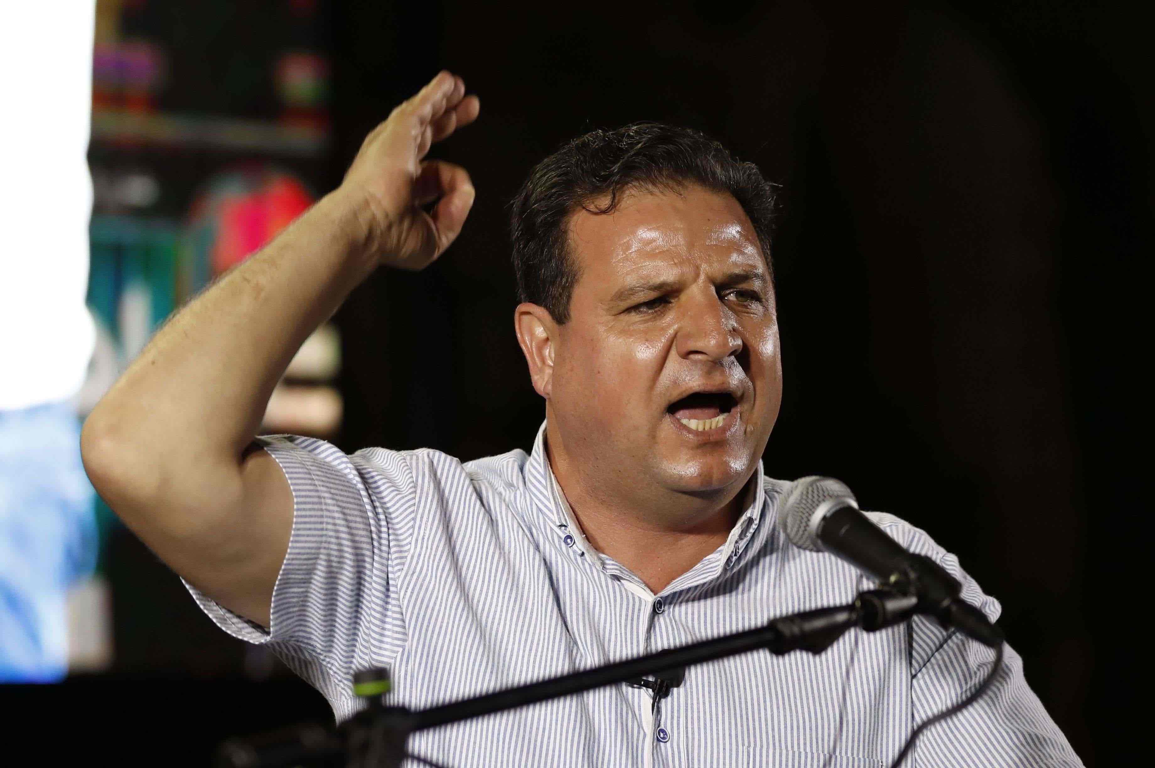 The head of the mainly Arab Joint List alliance Ayman Odeh speaks during an electoral campaign rally