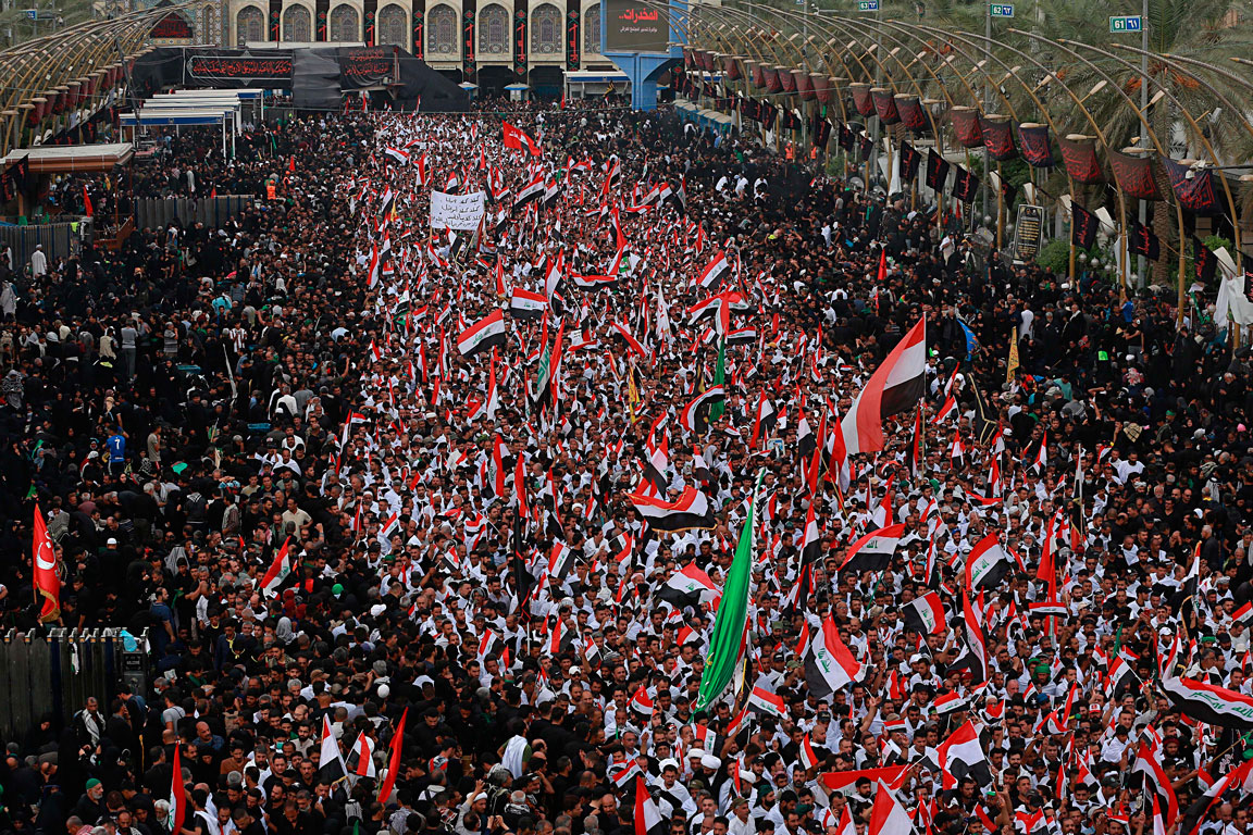 Followers of Shia cleric Moqtada Al Sadr chant slogans against corruption in Karbala, Iraq