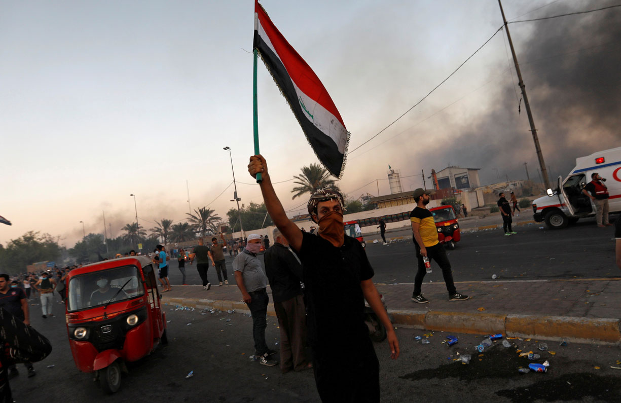 People hold an anti-government protest in Baghdad, Iraq