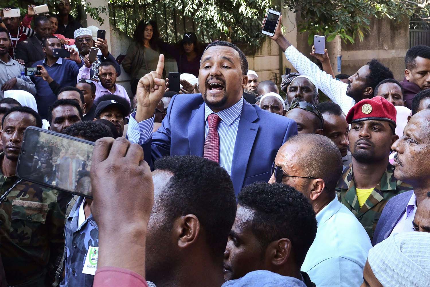 Jawar Mohammed addresses supporters that had gathered outside his home in Addis Ababa